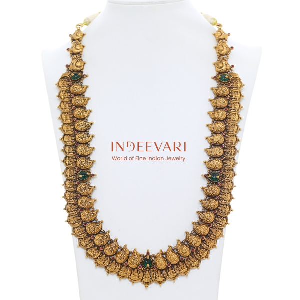 Traditional nakshi kasumala necklace with embossed gold coins featuring sacred iconography in balanced sequence, bead-linked flexible construction, and antique gold finish