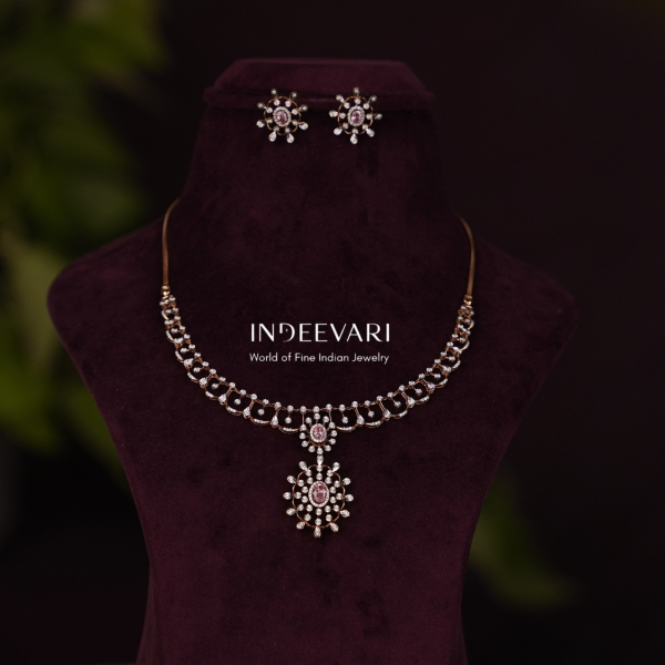 Pink tourmaline floral necklace surrounded by diamonds