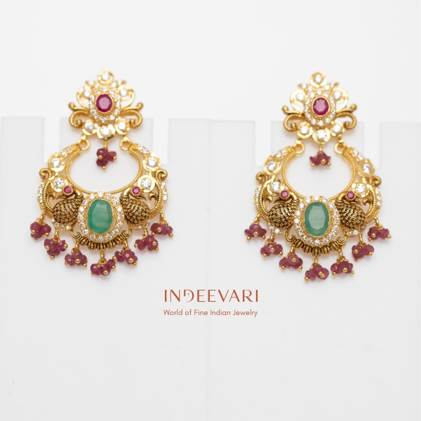 Peacock Majesty Pachi Chandbali earrings with peacock motifs, emeralds, cubic zirconia stones, and ruby beads – traditional Indian chand earrings in gold style