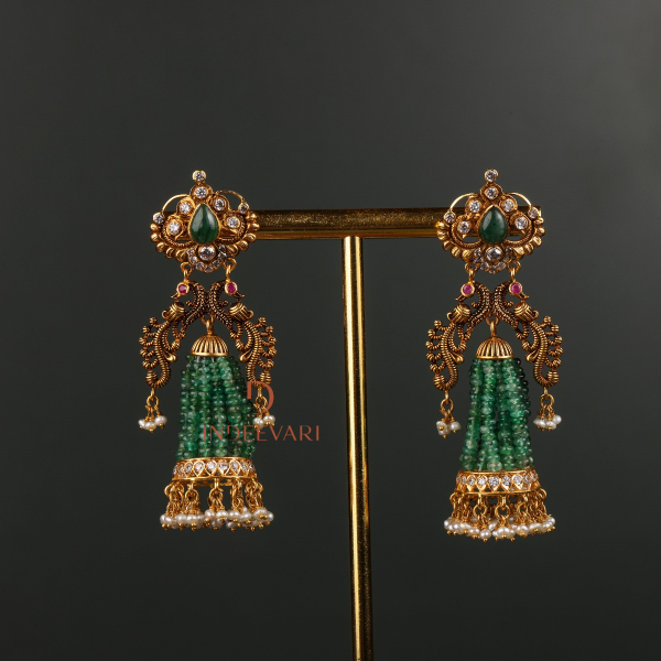 Sidha Emerald Beads Jhumkis in 22K gold with emerald beads, cubic zirconia stones, and pearl drops – traditional Indian jhumka earrings