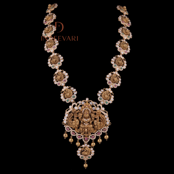 Yashkriti Lakshmi 5-in-1 Haram Necklace in gold with peacock motifs, Goddess Lakshmi pendant, rubies, emeralds, CZ stones, and pearl drops – traditional Indian bridal haram